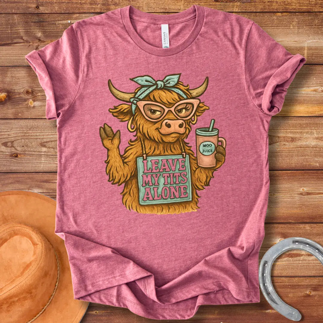 Illustration of a sassy cow wearing sunglasses, holding a Moo Juice drink and a sign that says 'Leave My Tits Alone'.