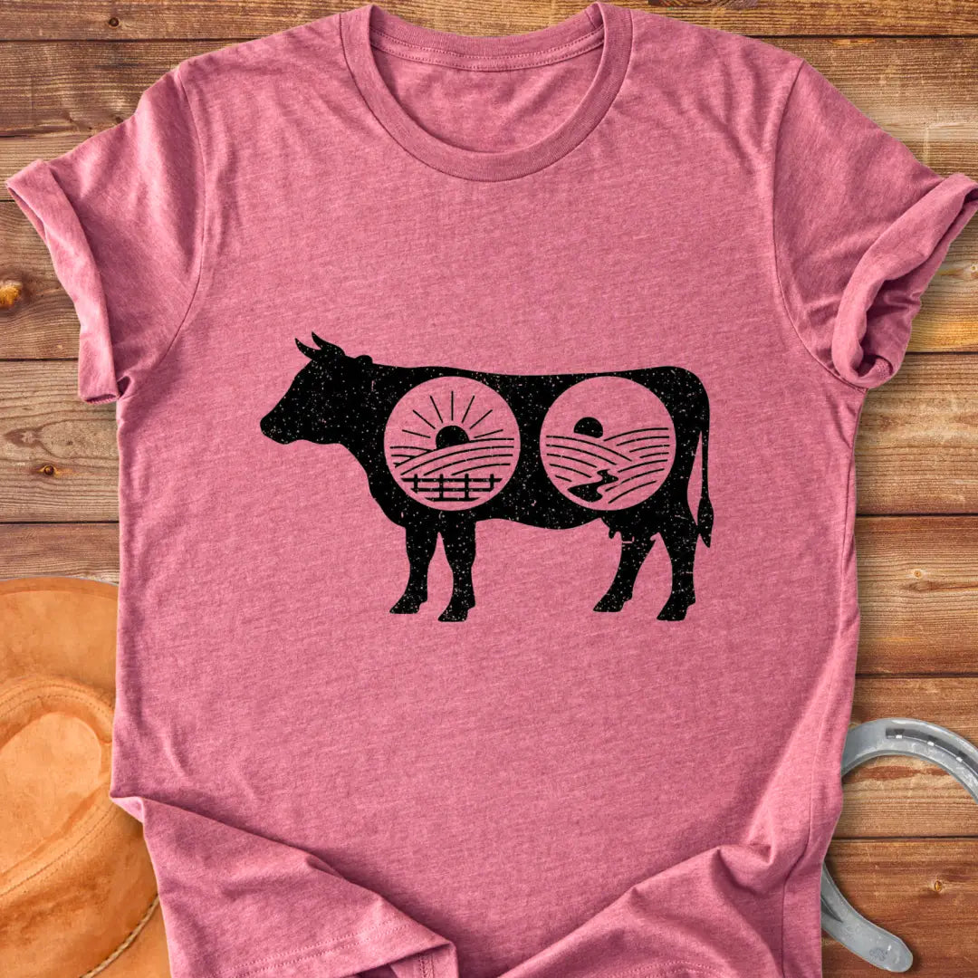 Cow silhouette t-shirt with farm landscapes inside, representing a starry night and a sunrise and sunset