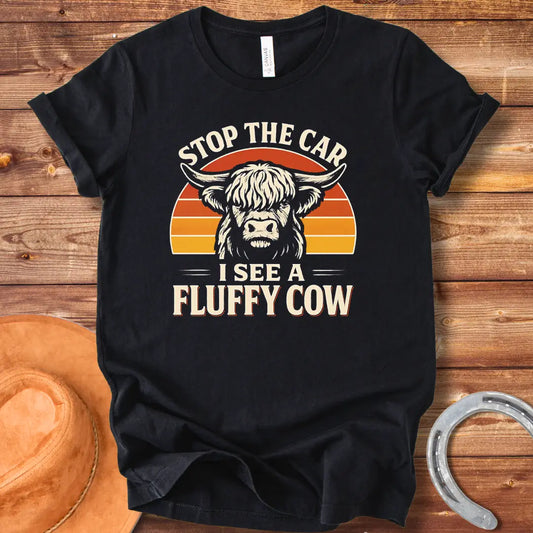 Vintage-style t-shirt design with a fluffy cow, the text 'Stop the Car, I see a Fluffy Cow' in a retro design.