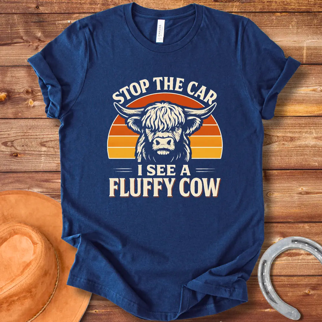 Vintage-style t-shirt design with a fluffy cow, the text 'Stop the Car, I see a Fluffy Cow' in a retro design.