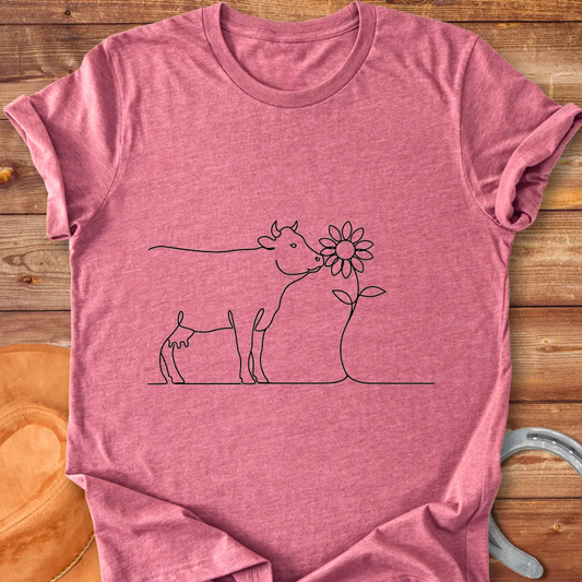 Line art illustration of a cow kissing a sunflower, a Cow Lovers Clothing product
