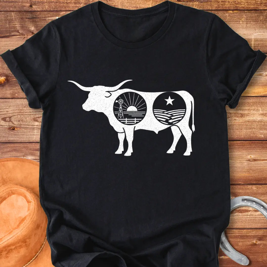 Black silhouette of a longhorn cow with a sunset scene and farmland detailing inside the cow's body.