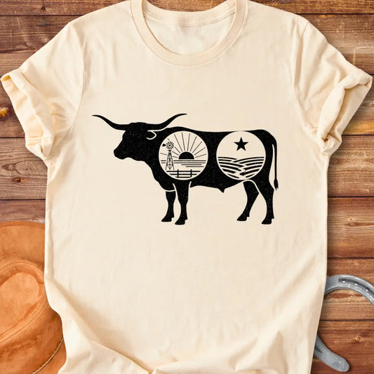 Black silhouette of a longhorn cow with a sunset scene and farmland detailing inside the cow's body.