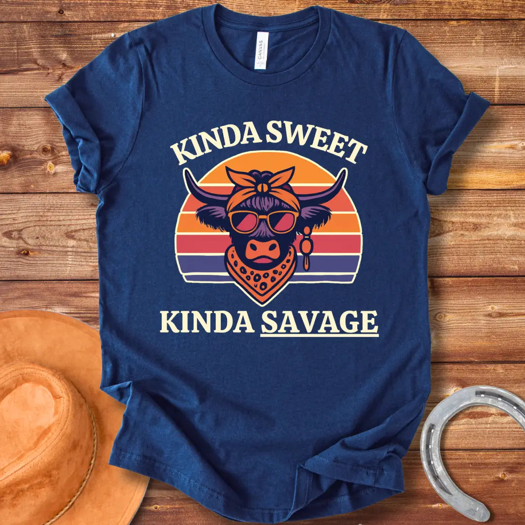 Retro t-shirt with a cool cow graphic, sunglasses, bandana, and the words 'Kinda Sweet, Kinda Savage' in a sunset background.