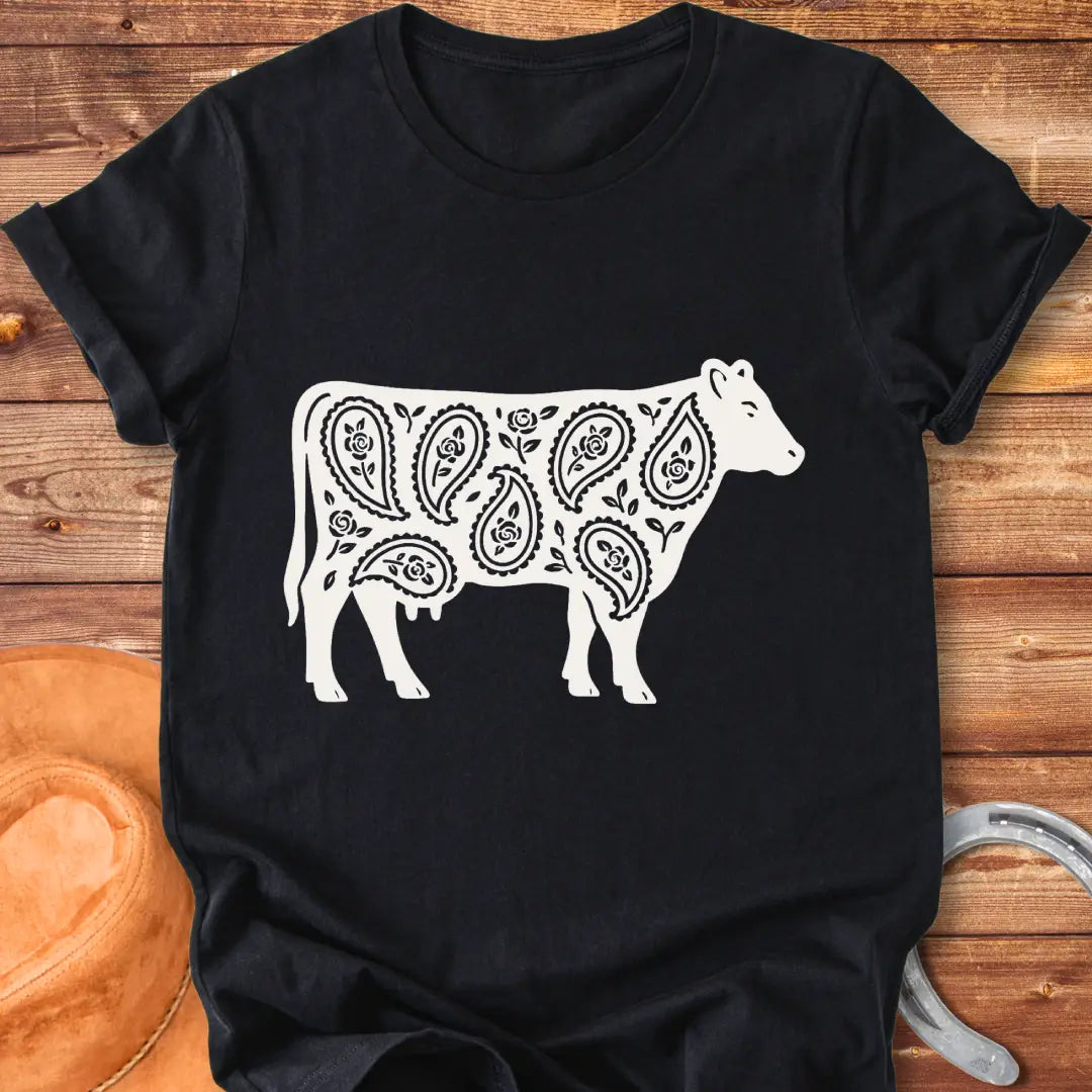 Black cow silhouette with paisley teardrop and rose floral pattern