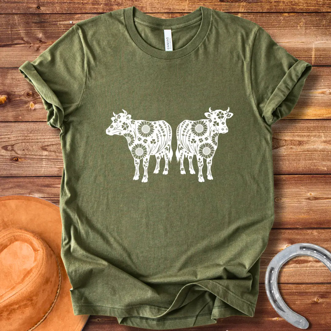 Twin floral cows t-shirt design featuring two cow silhouettes filled with sunflowers and floral patterns