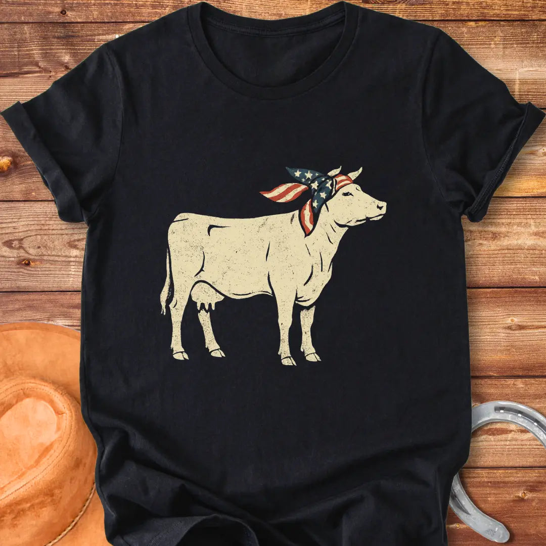 USA Cowgirl T-Shirt featuring a brown cow wearing an American flag bandana, patriotic cow design