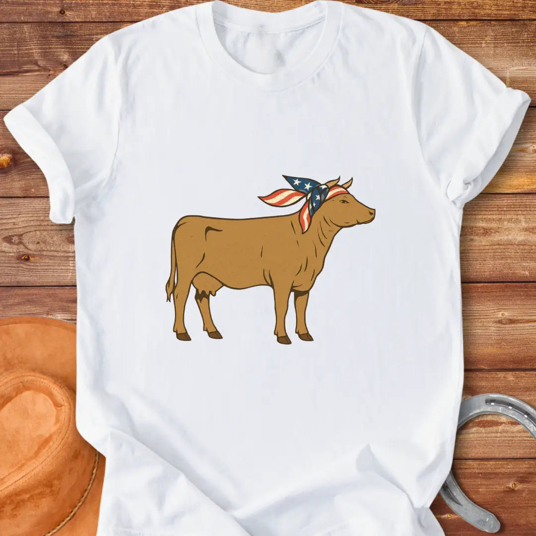 USA Cowgirl T-Shirt featuring a brown cow wearing an American flag bandana, patriotic cow design