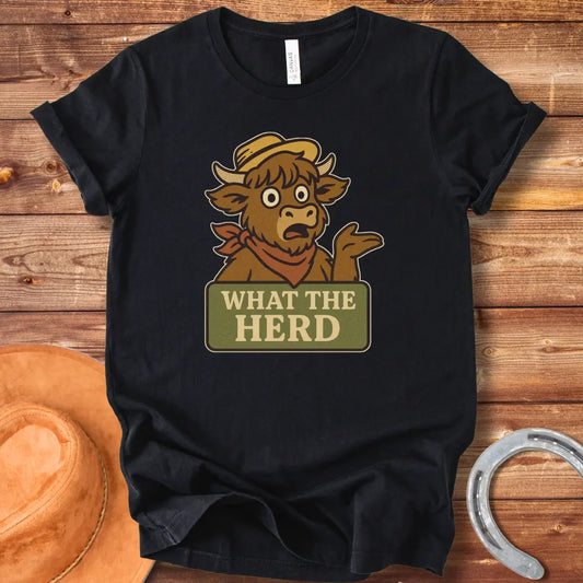 Funny t-shirt design featuring a surprised cow with the words 'What The Herd?' on a sign.