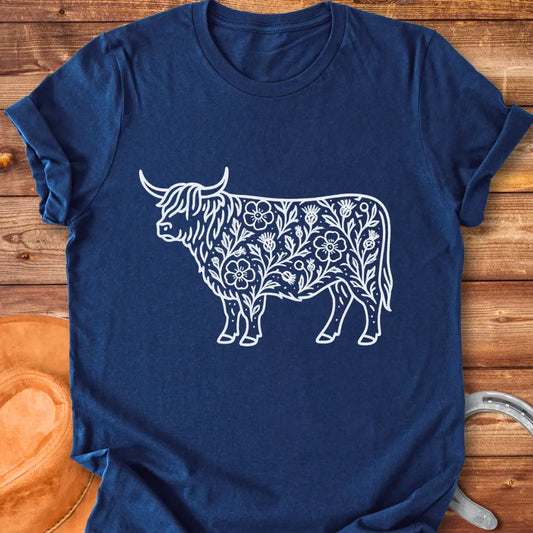 Black and white illustration of a Highland cow decorated with floral and leaf details, showcasing a Wild Rose Highland T-Shirt design.