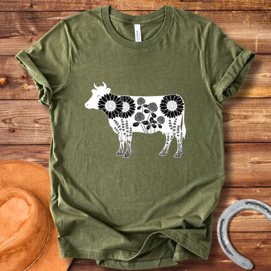 Black and white illustration of a cow filled with sunflowers, clover and lavender flowers