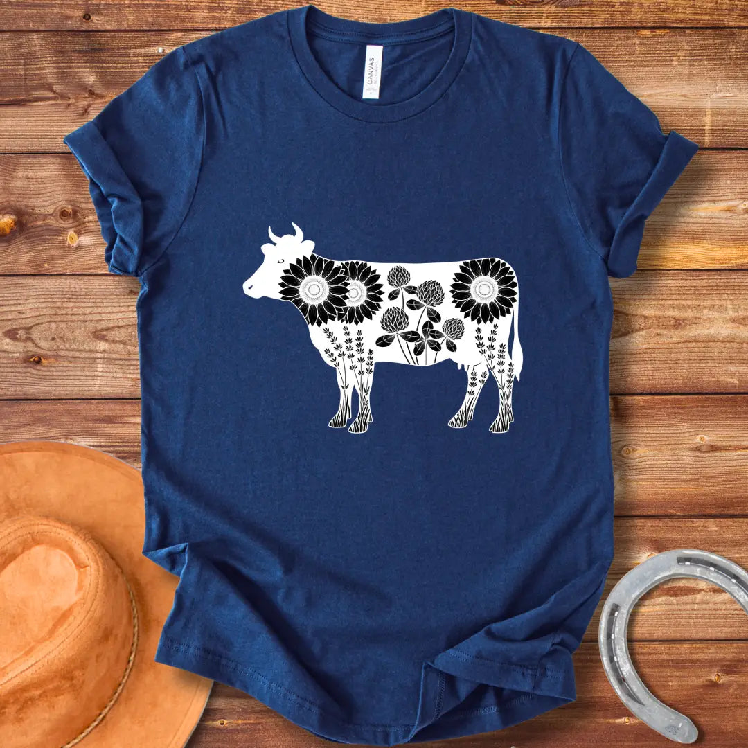 Black and white illustration of a cow filled with sunflowers, clover and lavender flowers
